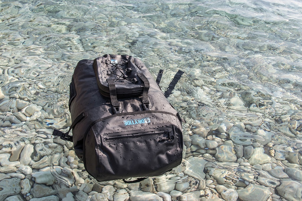 waterproof travel backpack floating in the sea